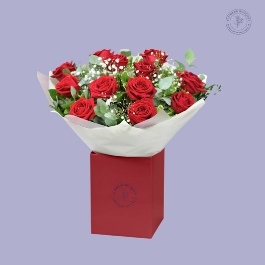 Elegant Duo Roses bouquet featuring red and pink roses, baby’s breath, and eucalyptus leaves in a red gift box.