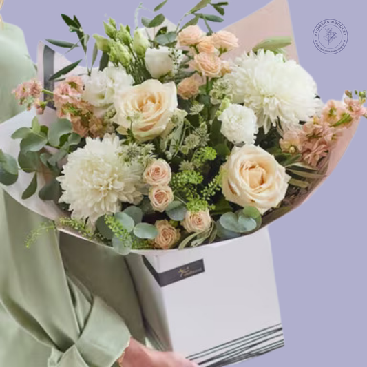 Elegant peach rose and white dahlia bouquet with eucalyptus leaves, presented in a premium white gift box.