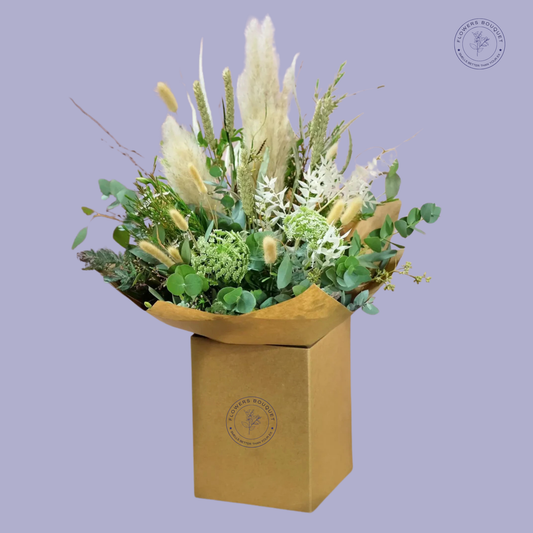 Rustic Elegance Bouquet featuring pampas grass, bunny tails, eucalyptus, and Queen Anne's Lace in a kraft paper gift box.